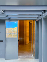An inviting doorway with the Psyche logo softly illuminated.