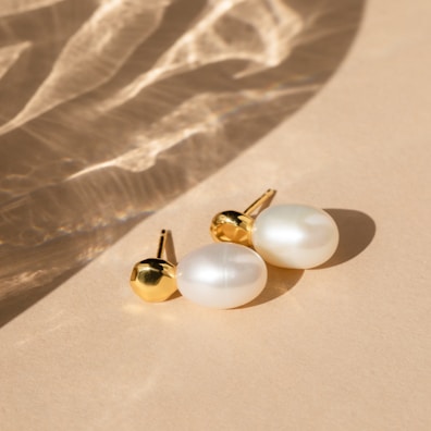 A pair of elegant earrings displayed with a soft focus.