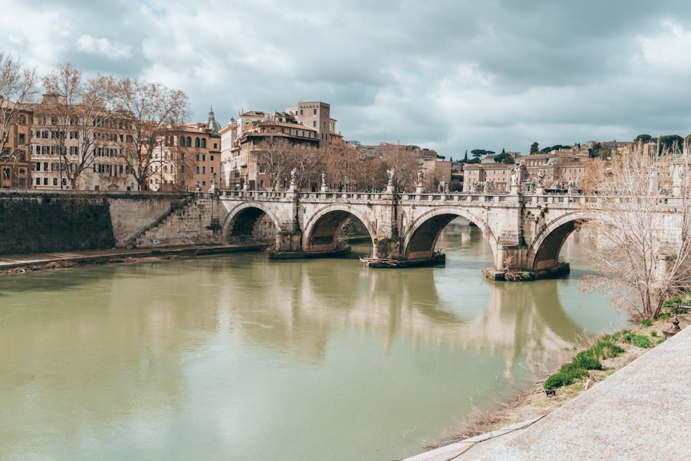 a bridge over a river in a city