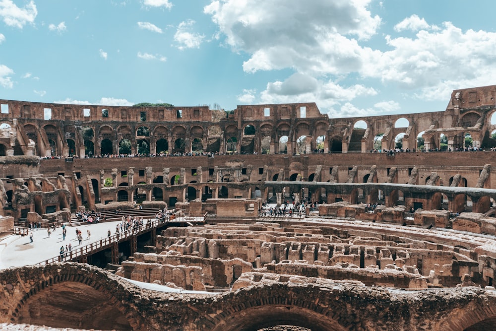 a group of people standing inside of a large building