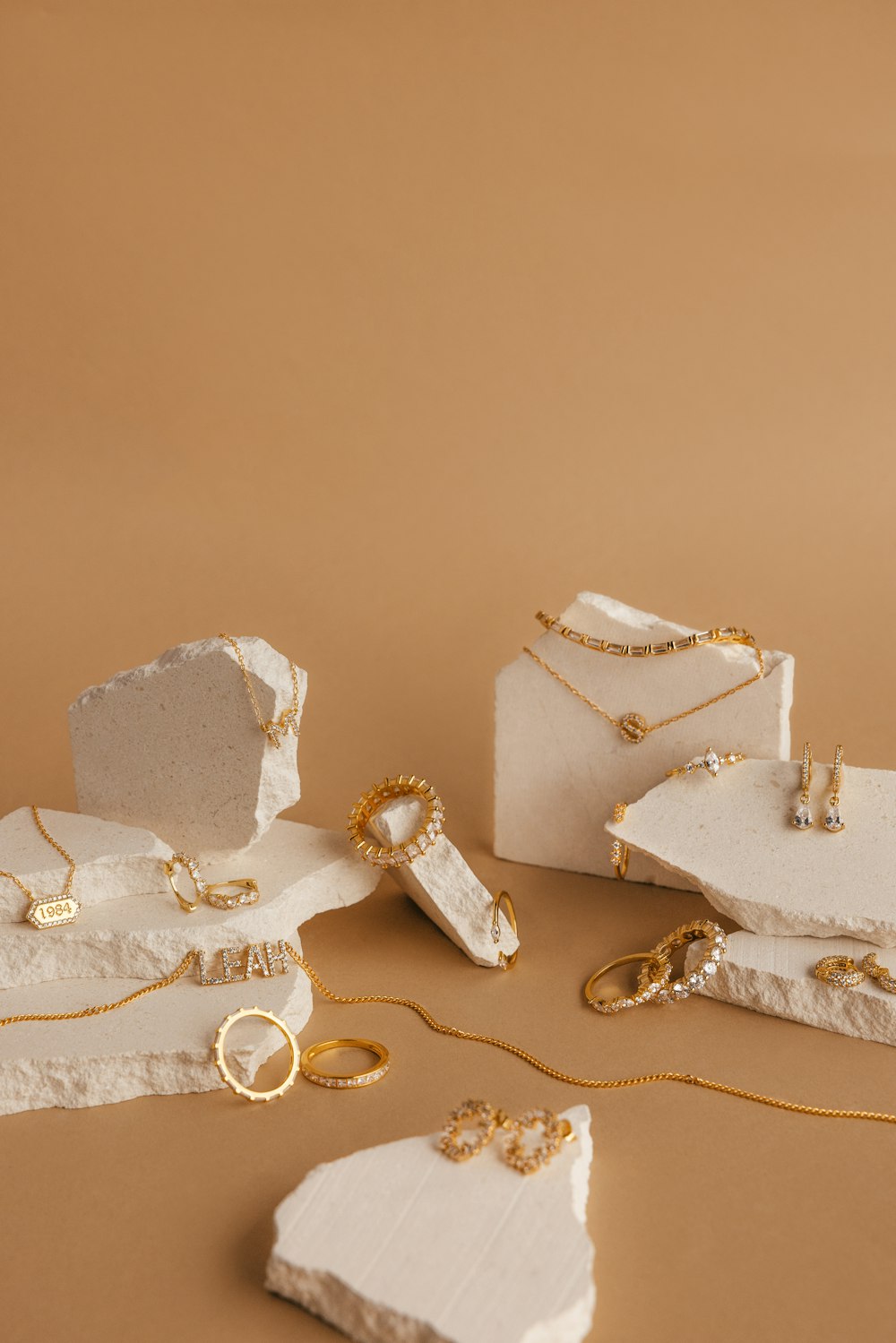 a table topped with jewelry and a piece of cake