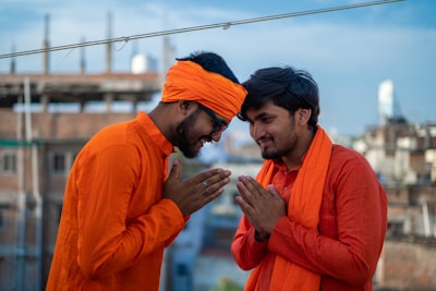 A handshake between two business partners with orange accents.