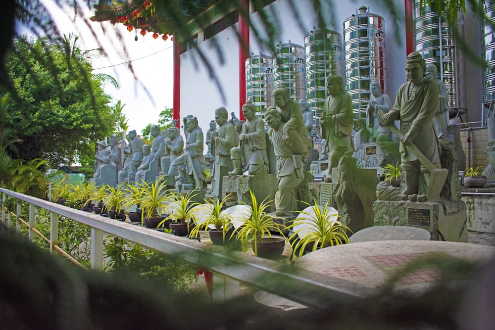 a group of statues sitting next to each other