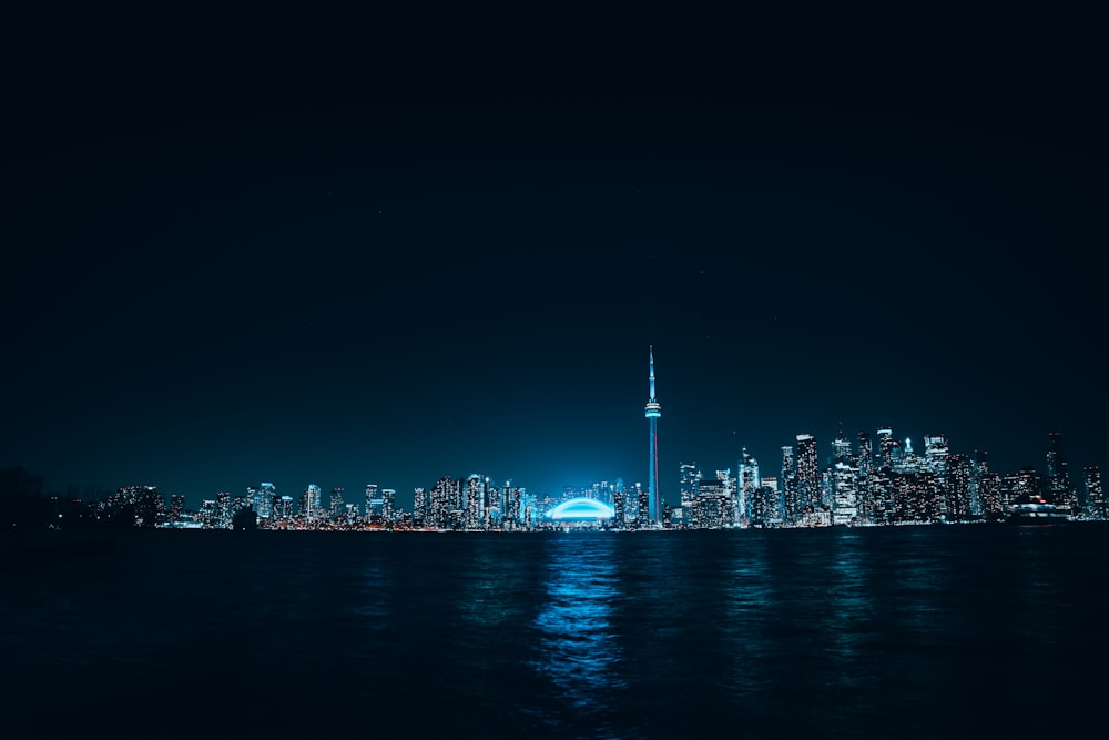 a view of a city at night from the water