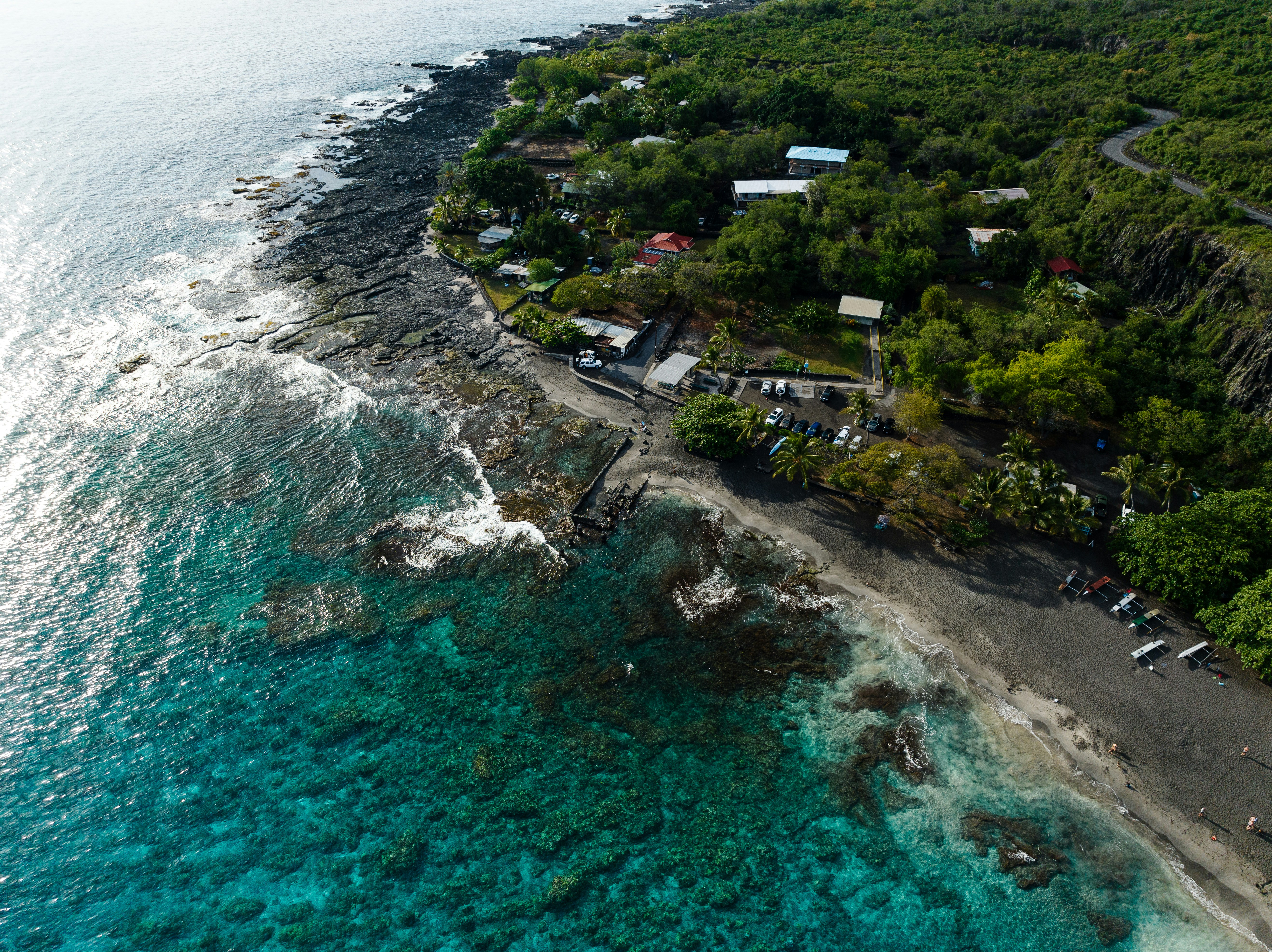 an aerial view of the ocean and a beach, 