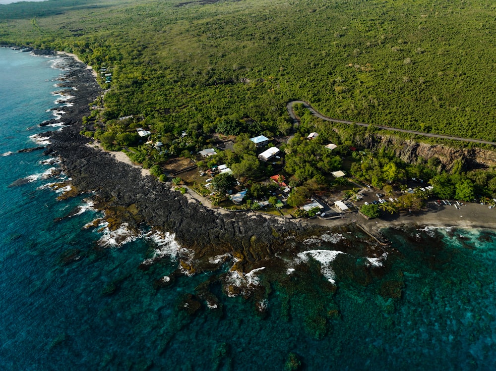 an aerial view of a small island with a road going through it