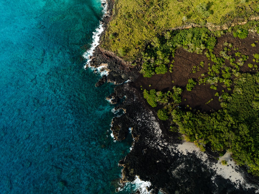 an aerial view of the ocean and land