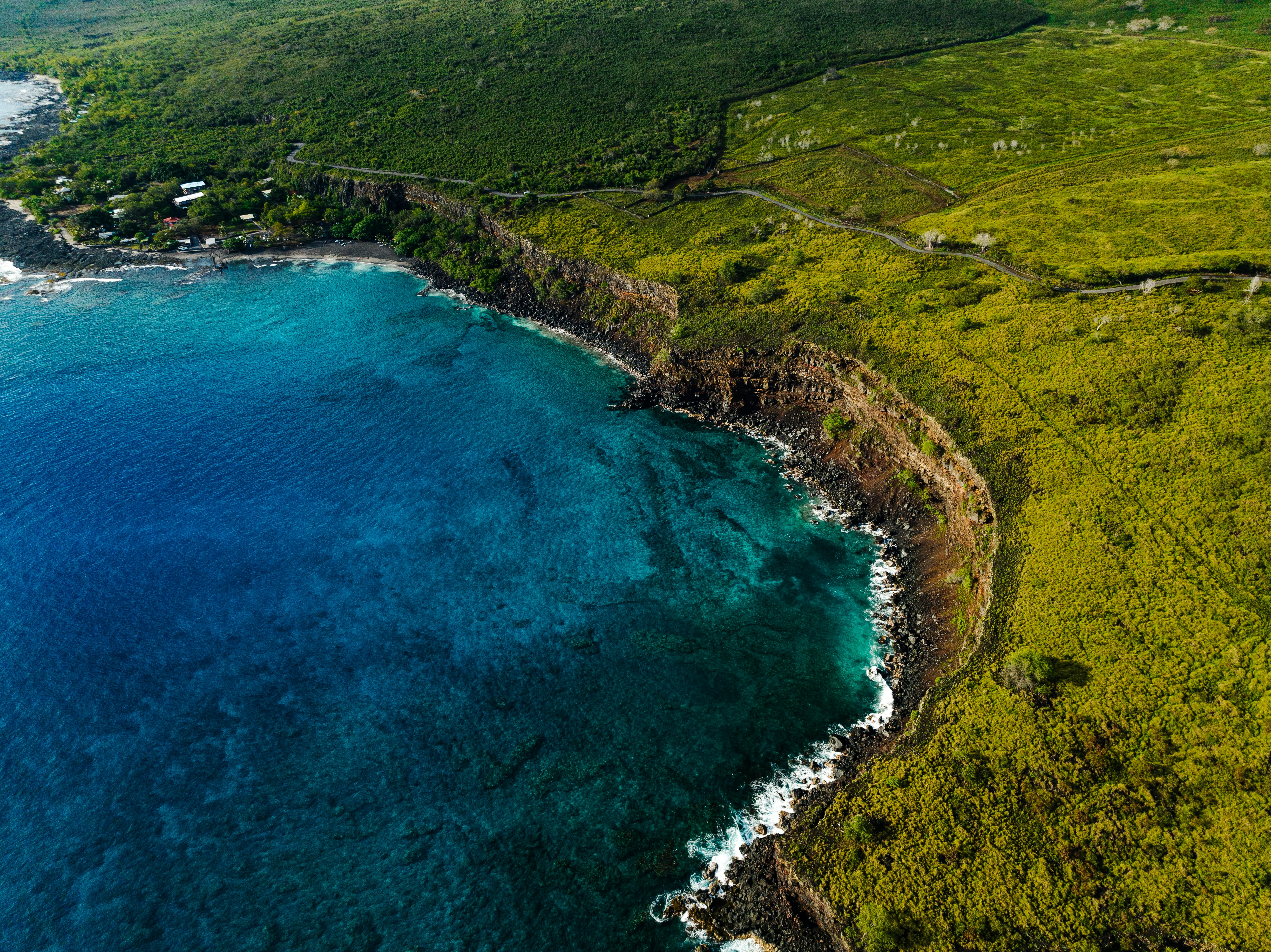 an aerial view of the ocean and land, 