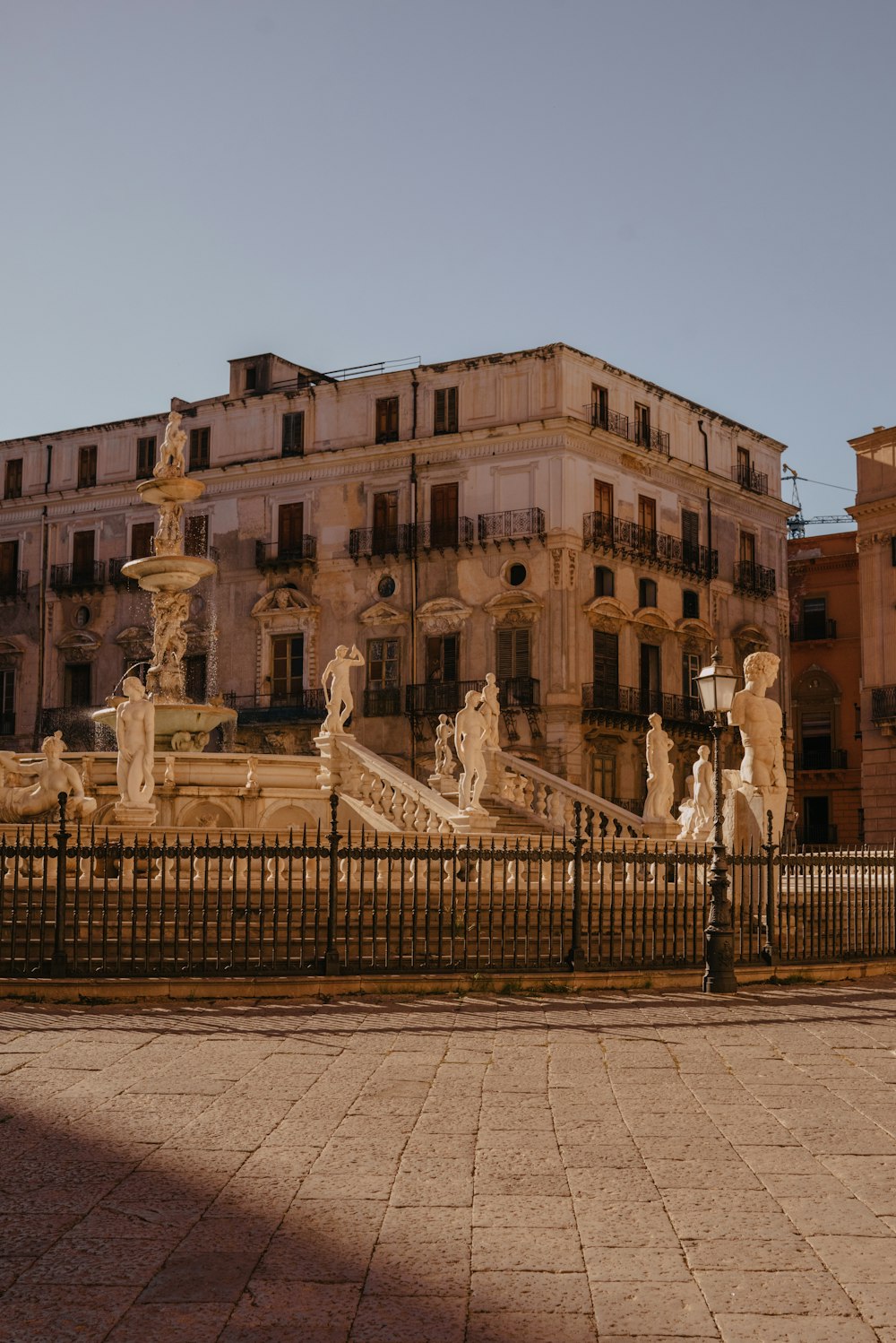 a large building with a fountain in front of it