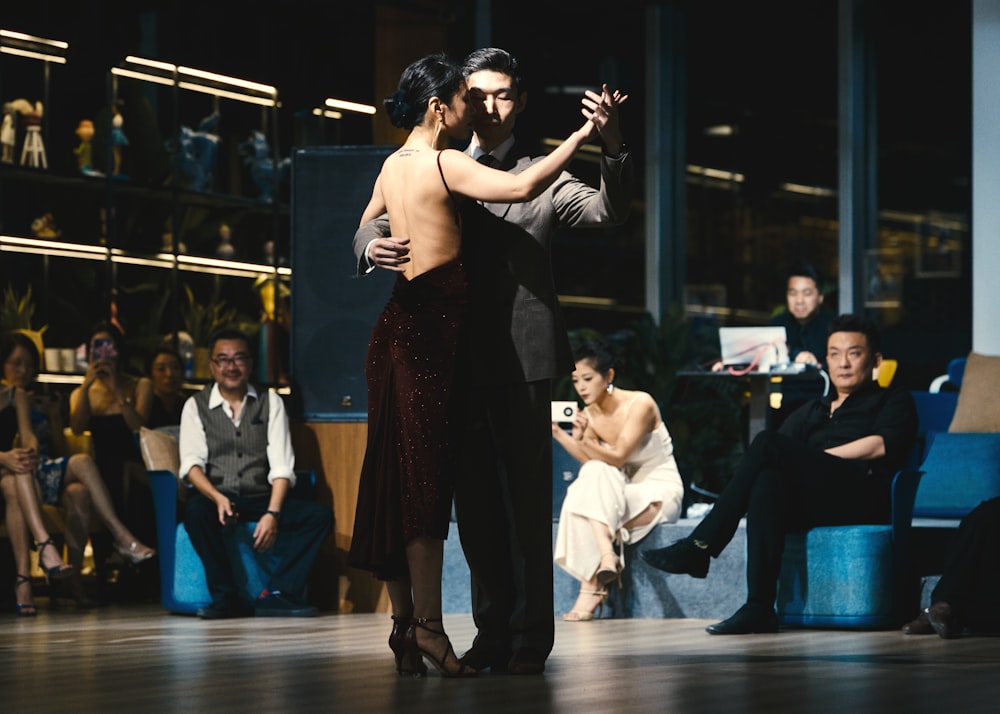 a man and a woman dancing on a stage