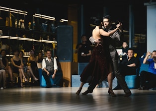 a couple of people that are on a dance floor