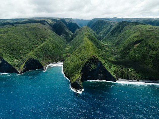 An aerial view of the ocean and mountains — Kauaʻi, United States