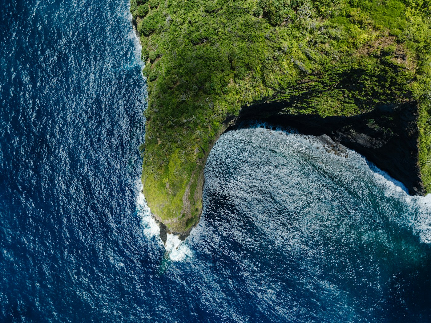 Aerial view of a remote Pacific atoll with turquoise lagoon