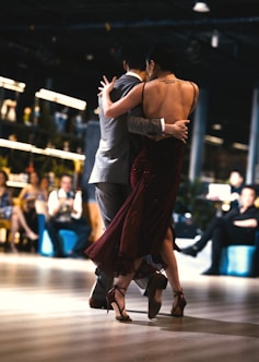 a couple of people that are dancing on a dance floor