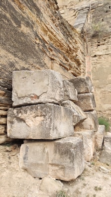 Large gres stone slabs leaning against a warehouse wall.