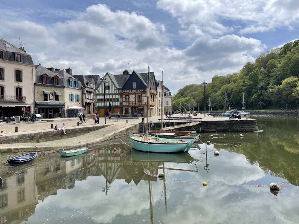 a body of water with several small boats in it