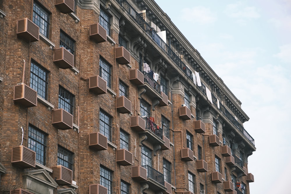 a tall brick building with lots of windows