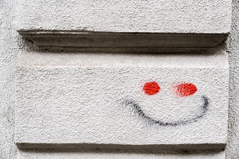 a close up of a face painted on a wall