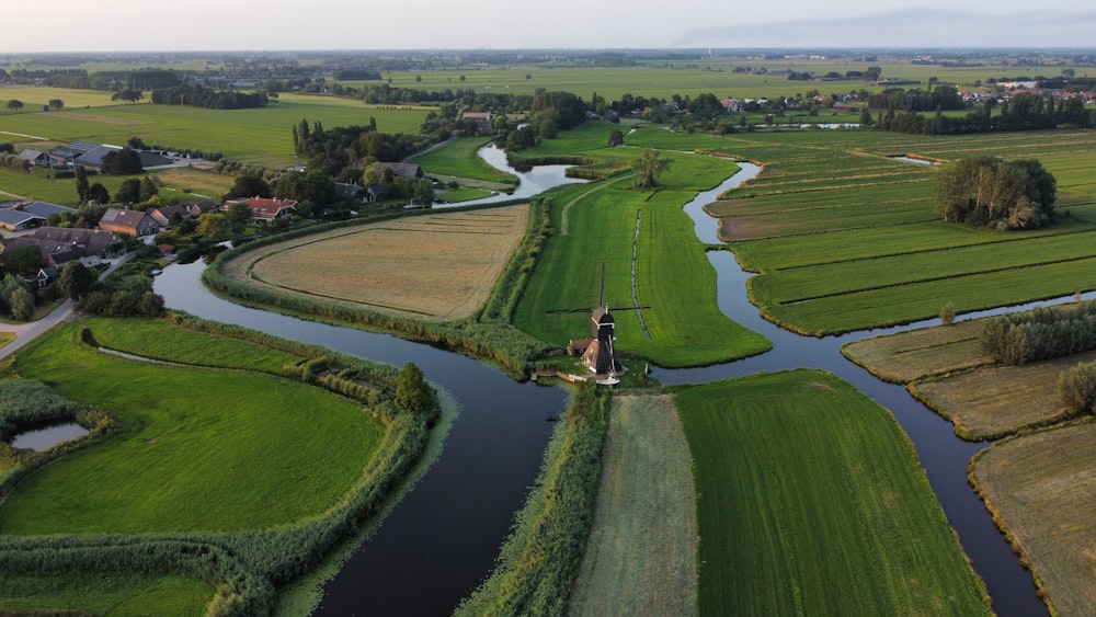 a river running through a lush green countryside