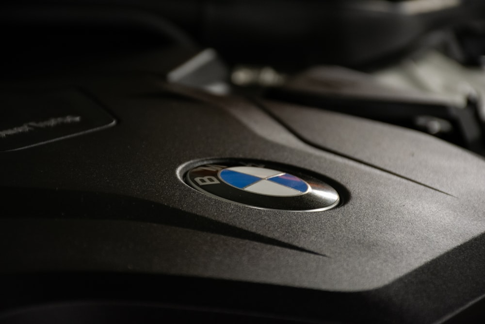 a close up of a bmw emblem on the hood of a car