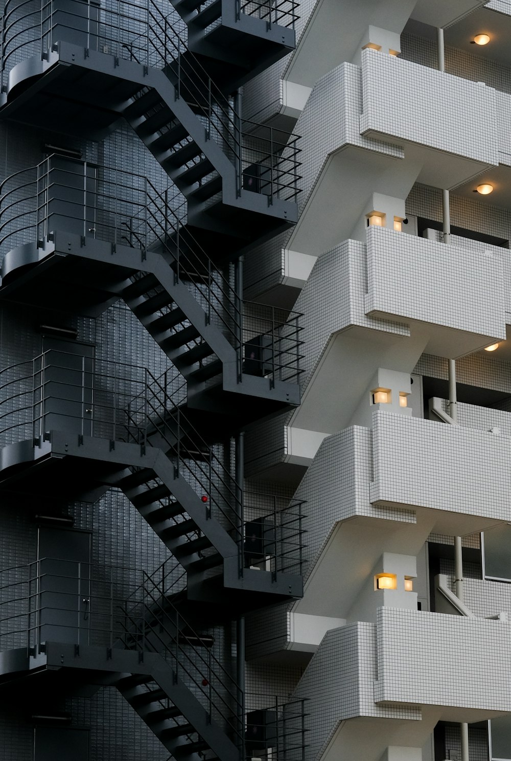 a very tall building with a bunch of balconies