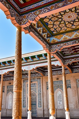 a building with columns and a tiled roof