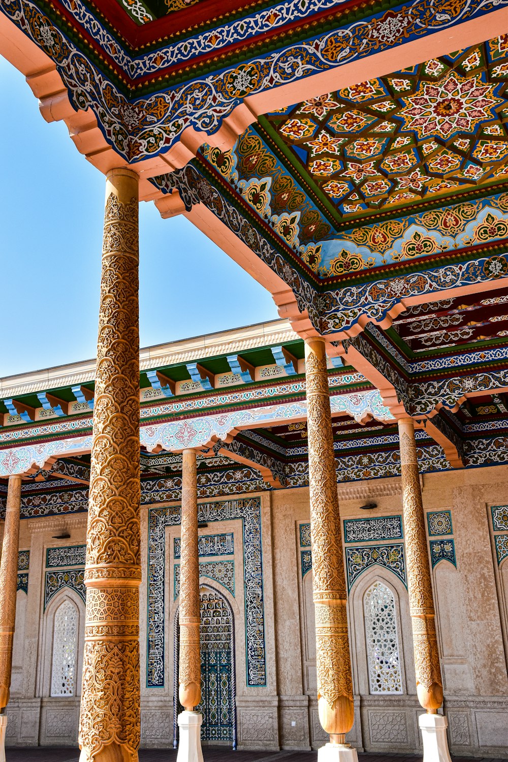 a building with columns and a tiled roof