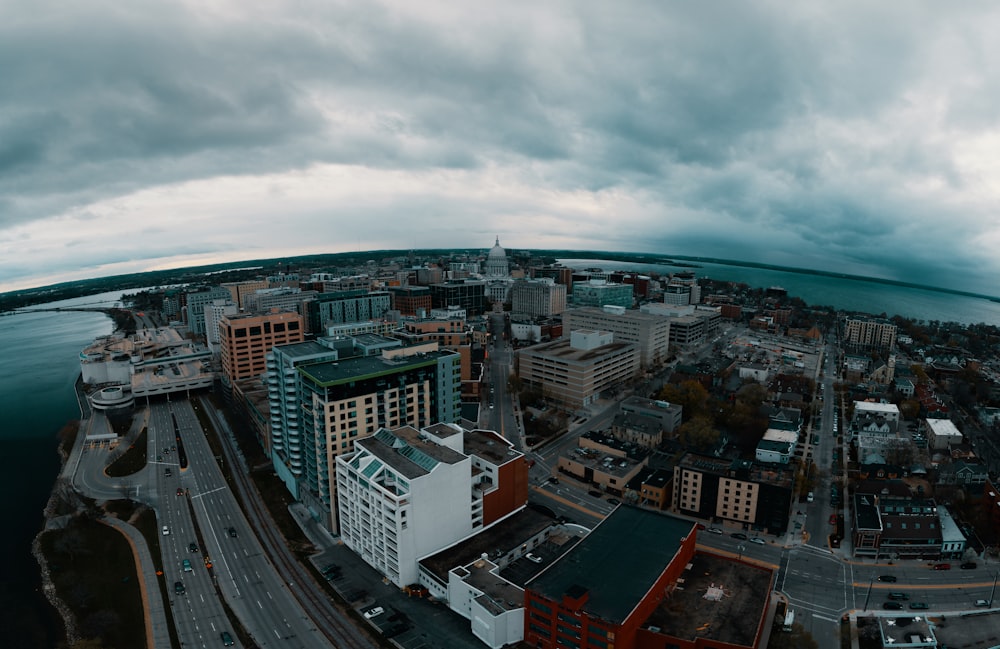 an aerial view of a city and a body of water