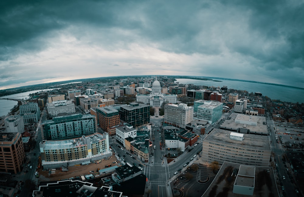 an aerial view of a city under a cloudy sky