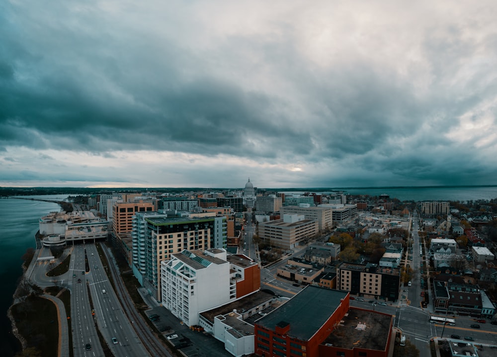 an aerial view of a city and a body of water