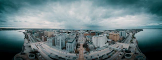A panoramic view of Kochi’s skyline blending old colonial architecture with modern buildings under a dramatic sky.