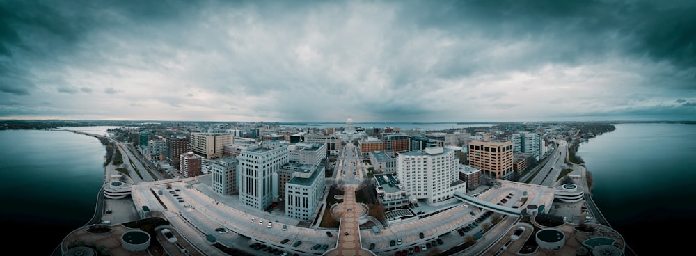 an aerial view of a city and a body of water