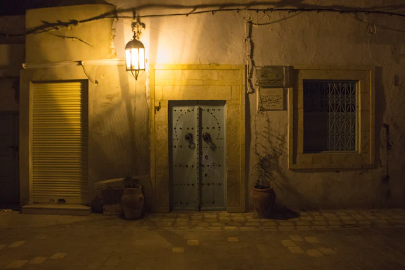 A warm, inviting doorway of a traditional Cyprus village home bathed in golden sunlight.