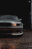 A shiny Fiat hatchback displayed under warm lighting.