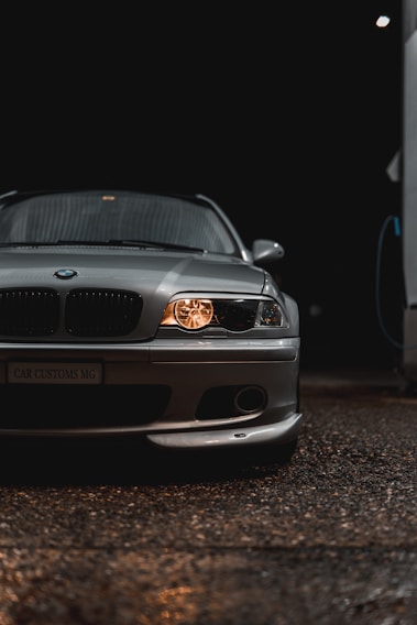 A sleek car lift bathed in warm golden light, highlighting its sturdy design.