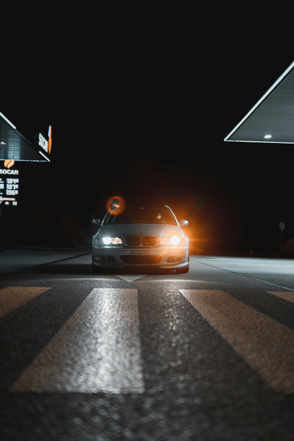 a car that is sitting in the street at night