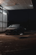 Covered parking lot with a clean car being serviced