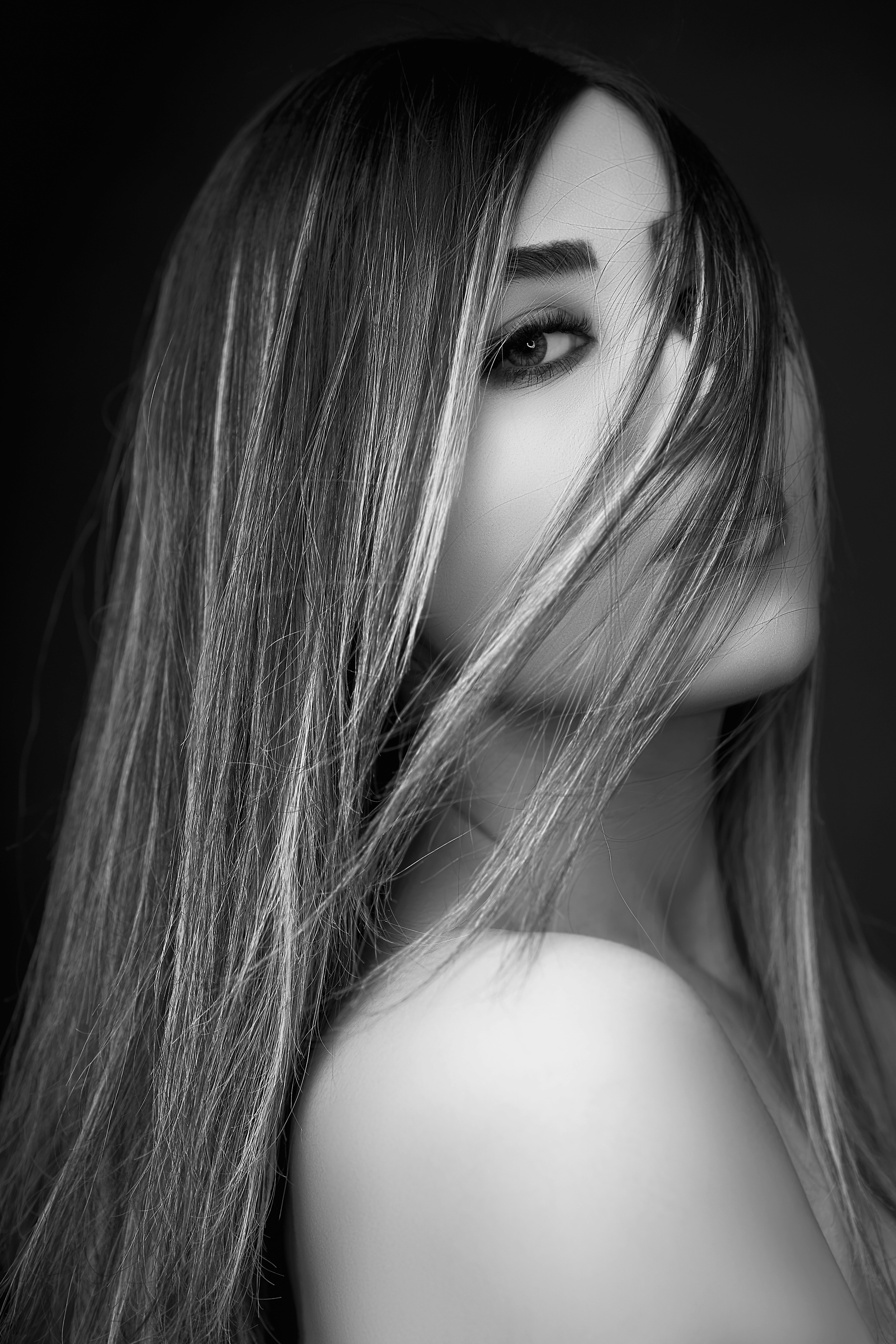 woman in red dress holding bouquet of flowers