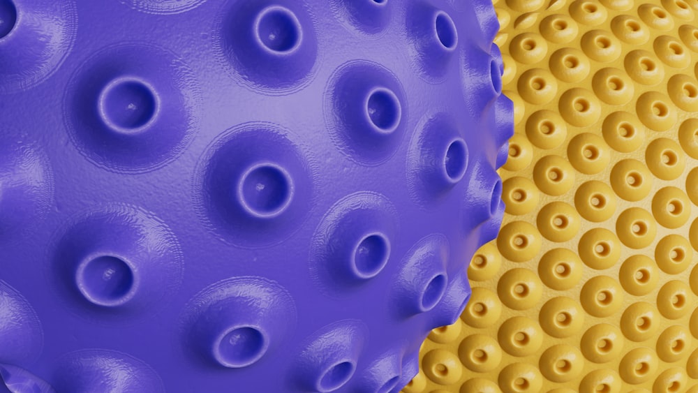 a close up of a yellow and purple object