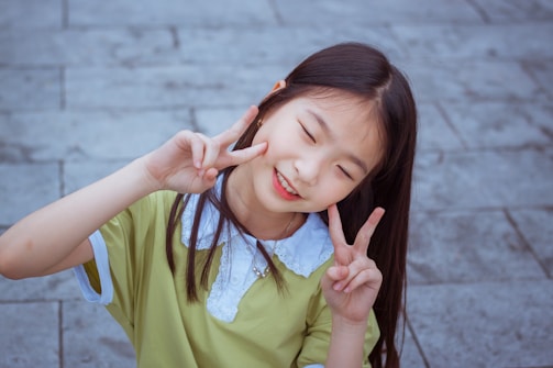 A smiling pageant girl speaking at a community event about digital peace.