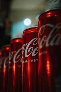 Close-up of custom aluminium cans with bright, bold graphics reflecting the healthy soda brand's personality