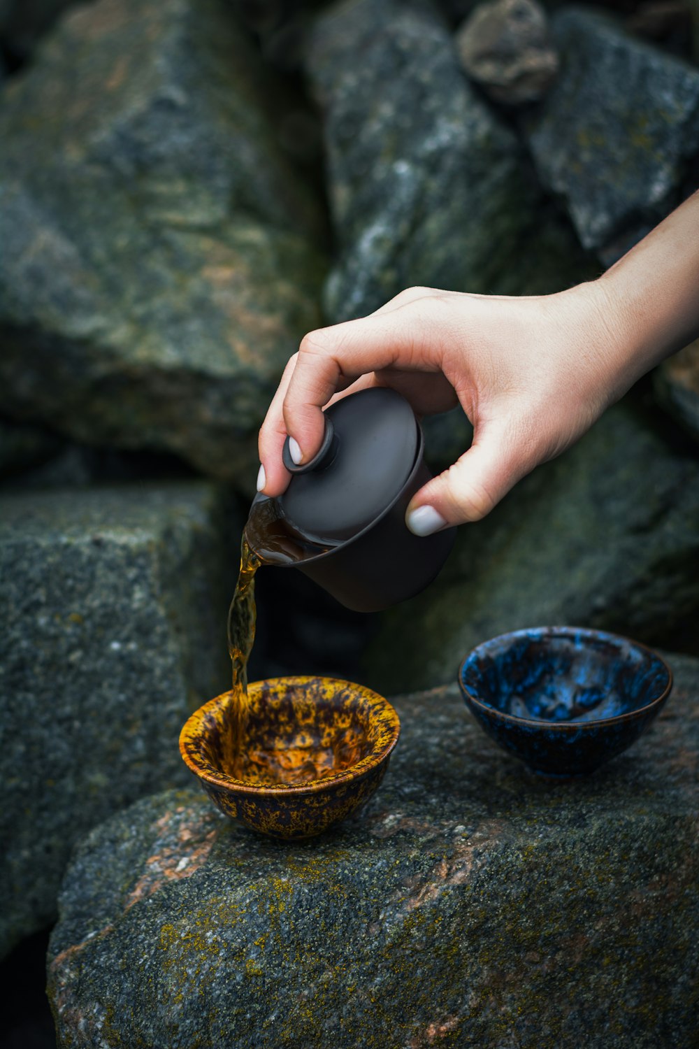 a person is pouring something into a bowl