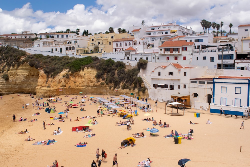 a crowded beach with many people on it