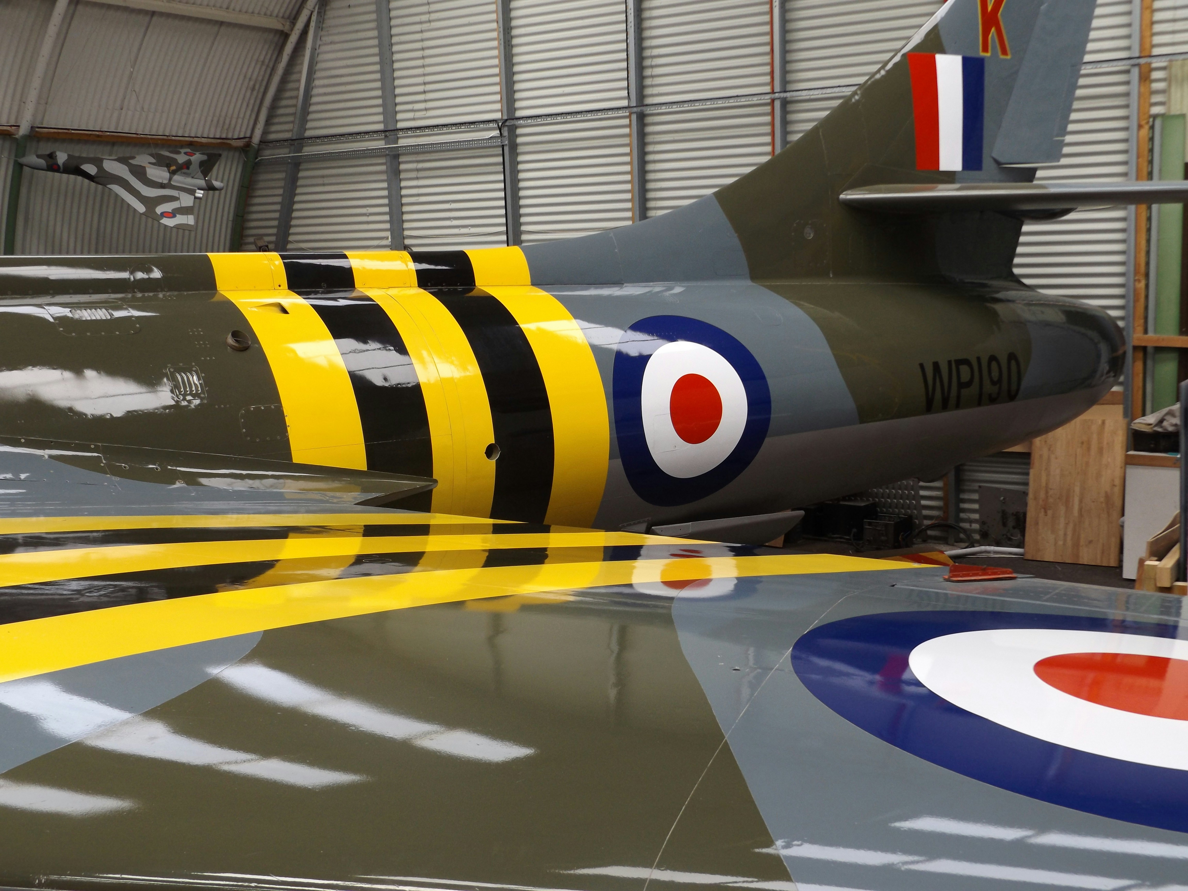 an airplane is parked inside of a hangar