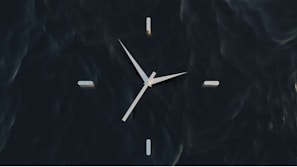 A stylish clock featuring a modern design and rich colors.
