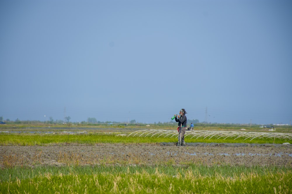 a person is flying a kite in a field