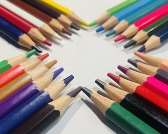 An array of colorful art supplies displayed on a table.