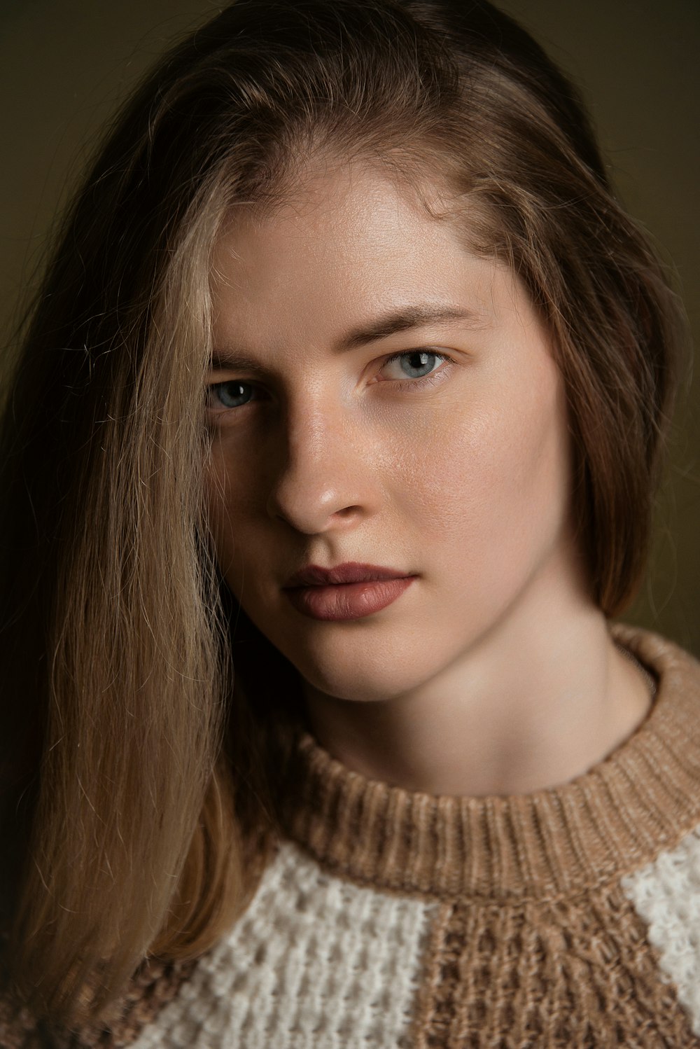 a close up of a person wearing a sweater