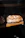 Close-up of a rustic artisan bread with a warm, natural light highlighting its texture.