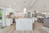 A well-equipped kitchen featuring modern appliances and a dining area with a tropical vibe.
